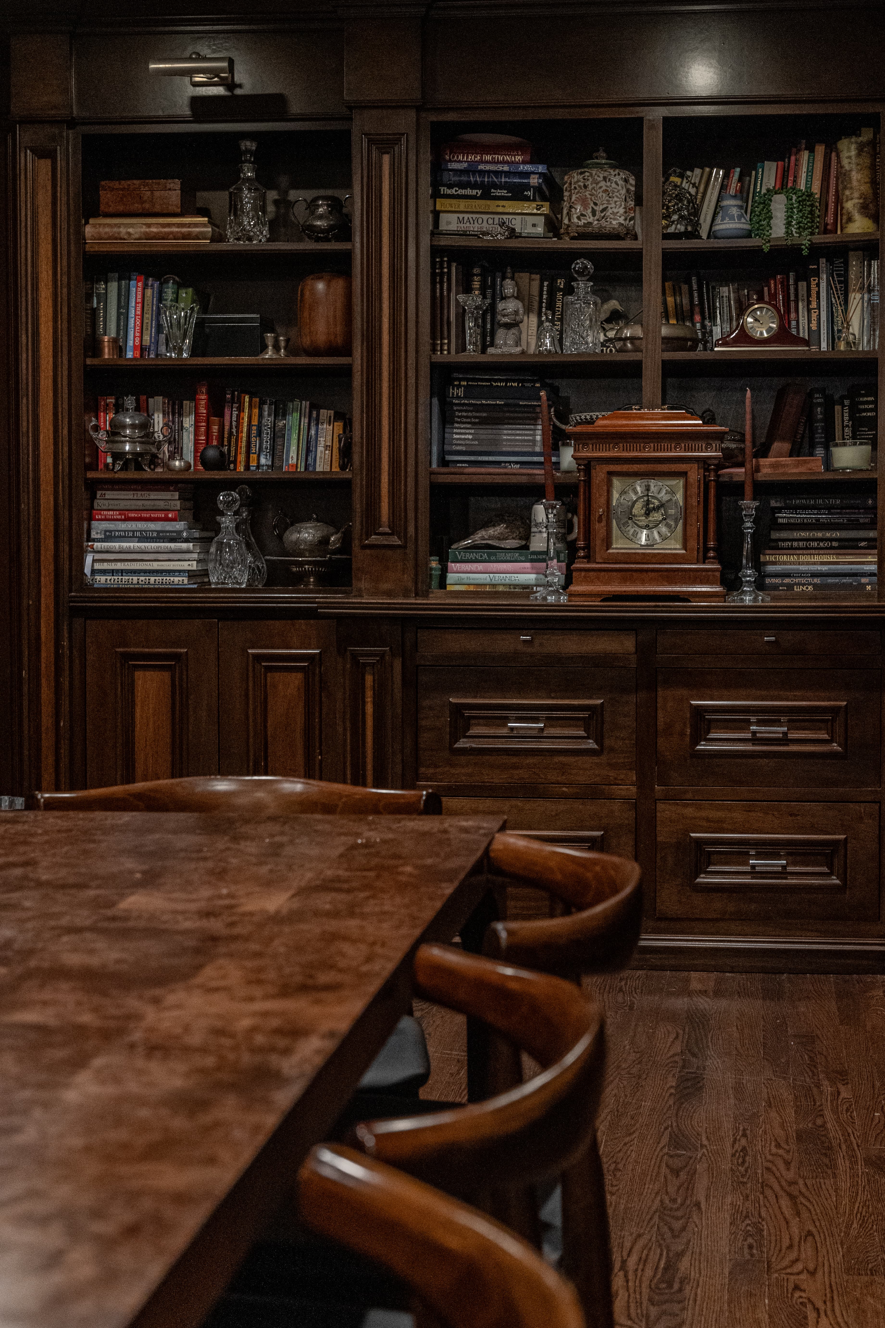 Restored walnut bookshelves in a wood-panelled room at Wheeler Mansion